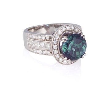 An 18K White Gold, Synthetic Color-Change Sapphire and Diamond Ring