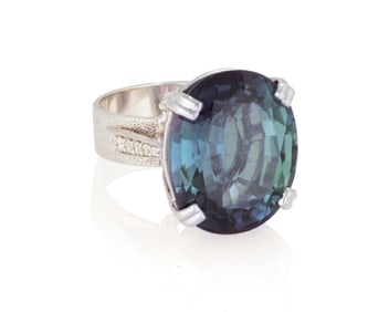 An 18K White Gold, Synthetic Color-Change Sapphire and Diamond Ring
