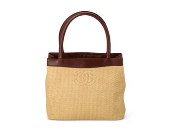 CHANEL: A Brown Leather and Raffia CC Tote Bag