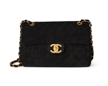 CHANEL: A Large Black Quilted Suede Classic Maxi Single Flap Bag
