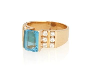 A 14K Gold and Blue Topaz ring