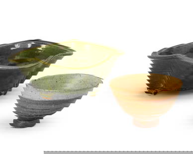 Warren Mackenzie (1924-2018), Two glazed ceramic bowls, mid/late 20th century: Warren Mackenzie (1924-2018)Two glazed ceramic bowls, mid/late 20th centuryEach marked to underside with potter's chop mark: MComprising a larger green glazed leaf-form bowl with spiral design to inte