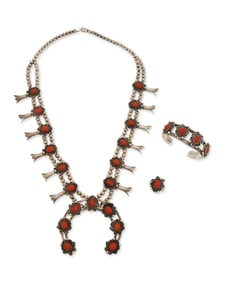 A set of Southwest silver and coral squash blossom jewelry