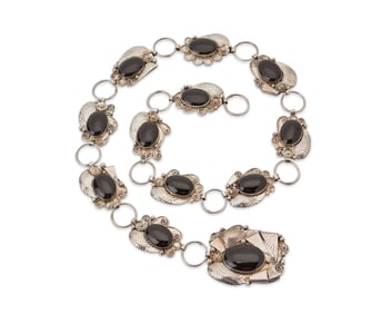 A Navajo sterling silver and onyx linked concho belt