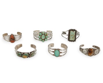 A group of Fred Harvey-style Southwest silver cuff bracelets