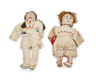 Two Native American beaded hide dolls