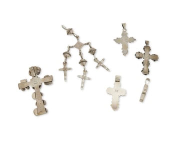A group of Southwest-style cross pendants