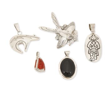 A group of Southwest sterling silver and stone pendants