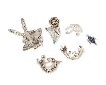 A group of Southwest-style silver brooches