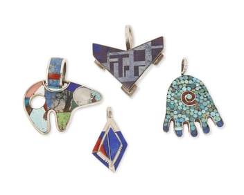 A group of Southwest sterling silver and stone pendants