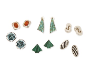 A group of Southwest-style silver and stone set earrings