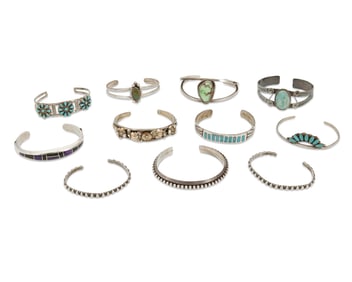 A large group of Southwest-style silver cuff bracelets