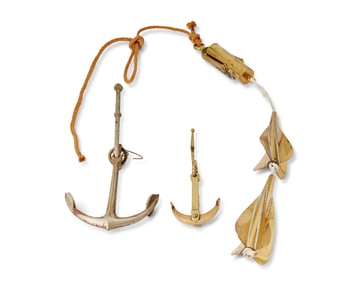 A John Bliss & Co. nautical taffrail log and two sample anchors