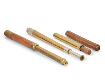 Three nautical telescopes and a hand bilge pump
