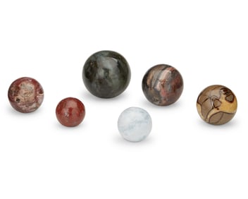Six spherical mineral specimens