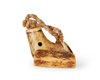 A Japanese carved stag antler netsuke