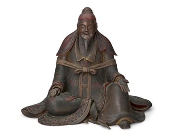 A Japanese carved wood figure of a Shinto priest