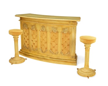 A Renaissance Revival-style bar and pair of stools