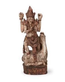 An Asian carved wood sculpture of a deity and attendant