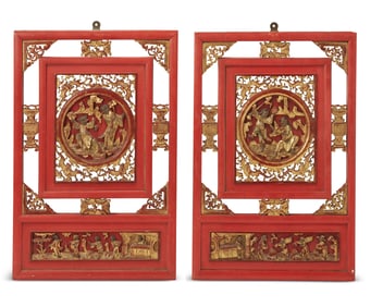 A pair of Chinese gilt and red lacquered wood panels