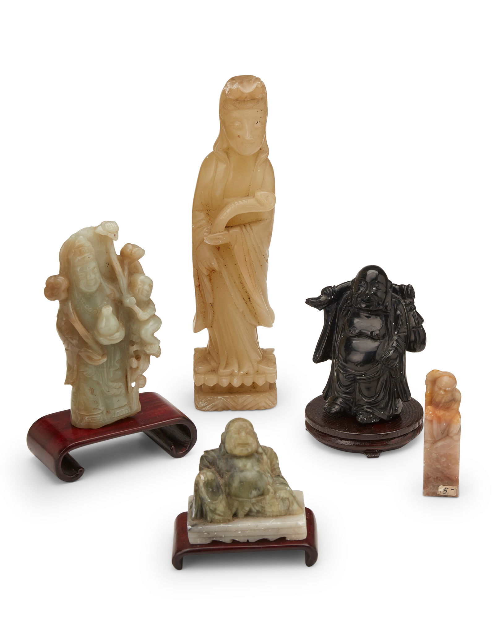 A group of Chinese carved hardstone figures: A group of Chinese carved hardstone figures20th centuryGuanyin incised to underside: CHINA; Ho Tai with applied sticker: Made in ChinaComprising a green stone figure of Ho Tai, a black stone travellin