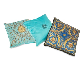 A group of Hermes and Versace designer silk throw pillows