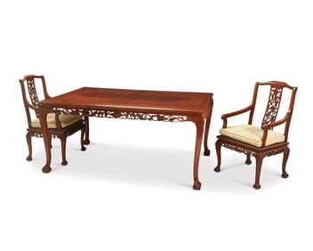 An Indonesian mahogany dining table and chairs