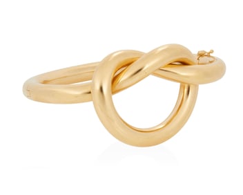 An 18K Gold Hinged Bangle