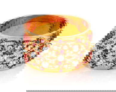 An 18K Gold, Diamond, Pearl and Ruby Hinged Bangle: An 18K Gold, Diamond, Pearl and Ruby Hinged BangleFeaturing an ornate design set with nine baroque pearls, eighteen round cabochon rubies, old European-cut diamonds weighing approximately 4.95 carats,
