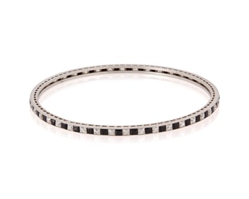 A Platinum, Onyx and Diamond Bangle