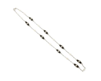 An Art Deco Onyx, Seed Pearl and Diamond Choker