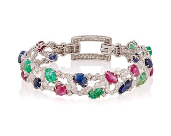 An Art Deco Platinum, Ruby, Emerald and Diamond Bracelet