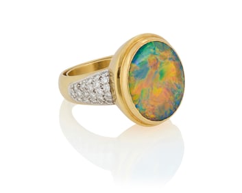 An 18K Gold, Black Opal and Diamond Ring