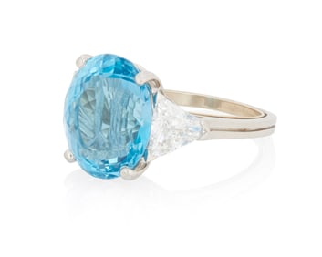 A Platinum, Blue Topaz and Diamond Ring