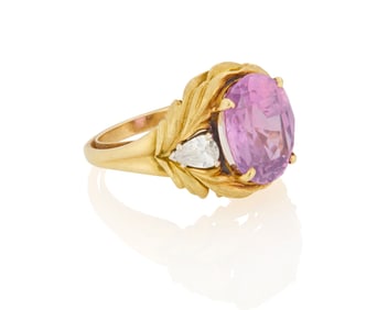 An 18K Gold, Purplish Pink Sapphire and Diamond Ring