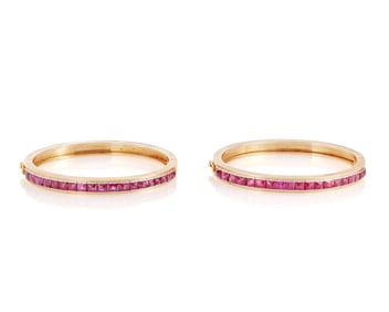 A Pair of 14K Gold and Ruby Bangles