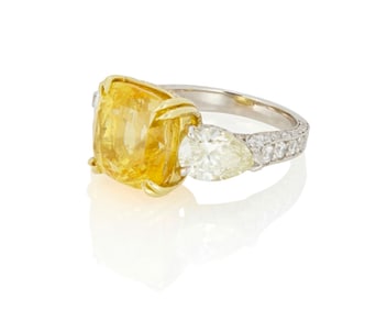 A Platinum, 18K Gold, Yellow Sapphire and Diamond ring