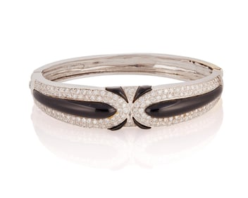 A Platinum Plated, 18K Gold, Onyx and Diamond Bangle