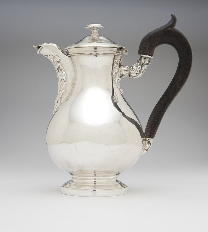 A Louis Philippe .950 silver chocolate pot: Circa 1840, Paris, mark of Jean Francois Veyrat (active 1832 - 1840), Minerva first standard mark, the domed hinged lid with knop finial over the pear-shaped body with short covered spout and downswep