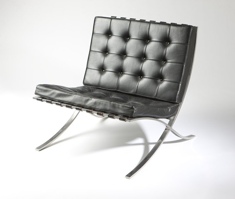 Ludwig Mies Van Der Rohe/Knoll 'Barcelona' chair: Circa 1970, designed 1929, with manufacturer's paper sticker label ''Knoll International / 322 Park Avenue / New York, N.Y. 10022'', and with Knoll Associates cushion tag, the tufted black leather foa