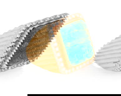 A 14K Gold, Emerald and Diamond Ring: A 14K Gold, Emerald and Diamond Ring Centering a rectangular carved emerald, encircled by round diamonds Size: 9 1/4 21.0 grams gross