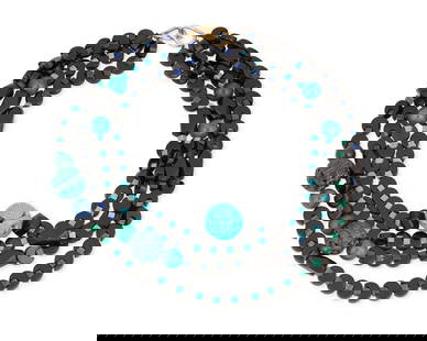 A Gold and Hardstone Necklace: A Gold and Hardstone Necklace Including four beaded strands including, onyx, glass, lapis lazuli and malachite Length: 18-22 in. 216.7 grams gross Provenance: Estate of a Lady, Hollywood, CA