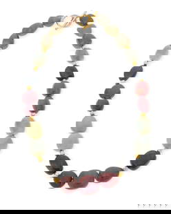 A Gold and Sapphire Bead Necklace: A Gold and Sapphire Bead Necklace Featuring multi-colored graduated sapphire beads finished with an 18k gold toggle clasp Length: 20 in. 152.7 grams gross