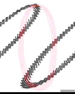 Gumps: A 14K Gold, Ruby and Pink Tourmaline Necklace: Gumps: A 14K Gold, Ruby and Pink Tourmaline Necklace Featuring four strands of graduated ruby beads finished with a 14k gold and oval pink tourmaline cabochons clasp, signed Gumps Length: 28 in.