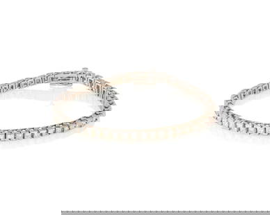 A 14K White Gold and Diamond Bracelet: A 14K White Gold and Diamond Bracelet Featuring fifty princess-cut diamonds weighing approximately 5.00 carats Length: 7 in. 13.1 grams gross