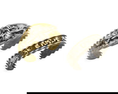 King Baby: Two Sterling Silver Cuff Bracelets: King Baby: Two Sterling Silver Cuff Bracelets Comprising two chunky cuffs, one in mixed metal brass with an ornate silver overlay motif, and one a narrow cuff with Native American motifs and