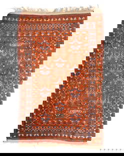 A Turkoman rug, 20th century: A Turkoman rug 20th century A hand-knotted wool pile rug in brown, cream, and dark blue with floral motifs, and triple borders with various geometric motifs and "Welcome" plaque woven to