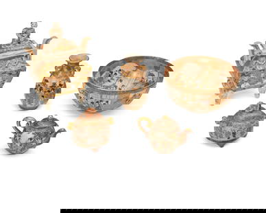 A group of Japanese Satsuma pottery items: A group of Japanese Satsuma pottery items 20th century Most variously marked to underside The diminutive earthenware items, each heavily gilt and enameled depicting figural scenes, comprising a