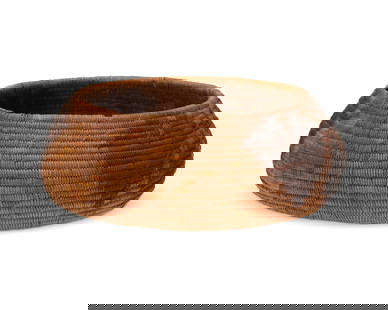 A polychrome California Mission pictorial basket: A polychrome California Mission pictorial basket Early 20th century; Southern California A coiled low bowl with contrasting leaf and butterfly motifs to sides and floral motif to base 2.5" H x