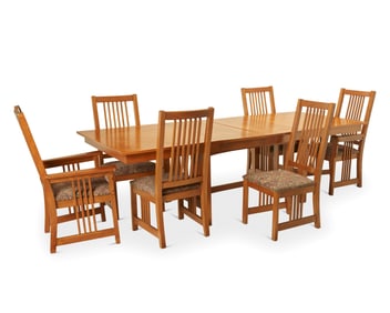 A Contemporary Mission-style trestle dining table and chairs